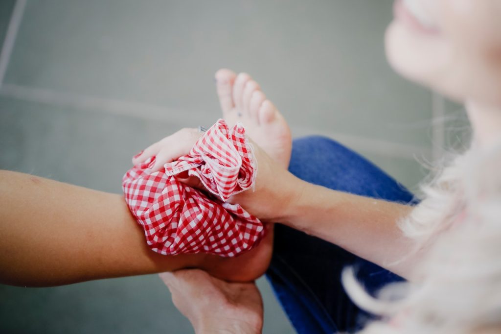 Applying ice pack on ankle